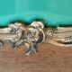 Old wooden frame and bronze ornament