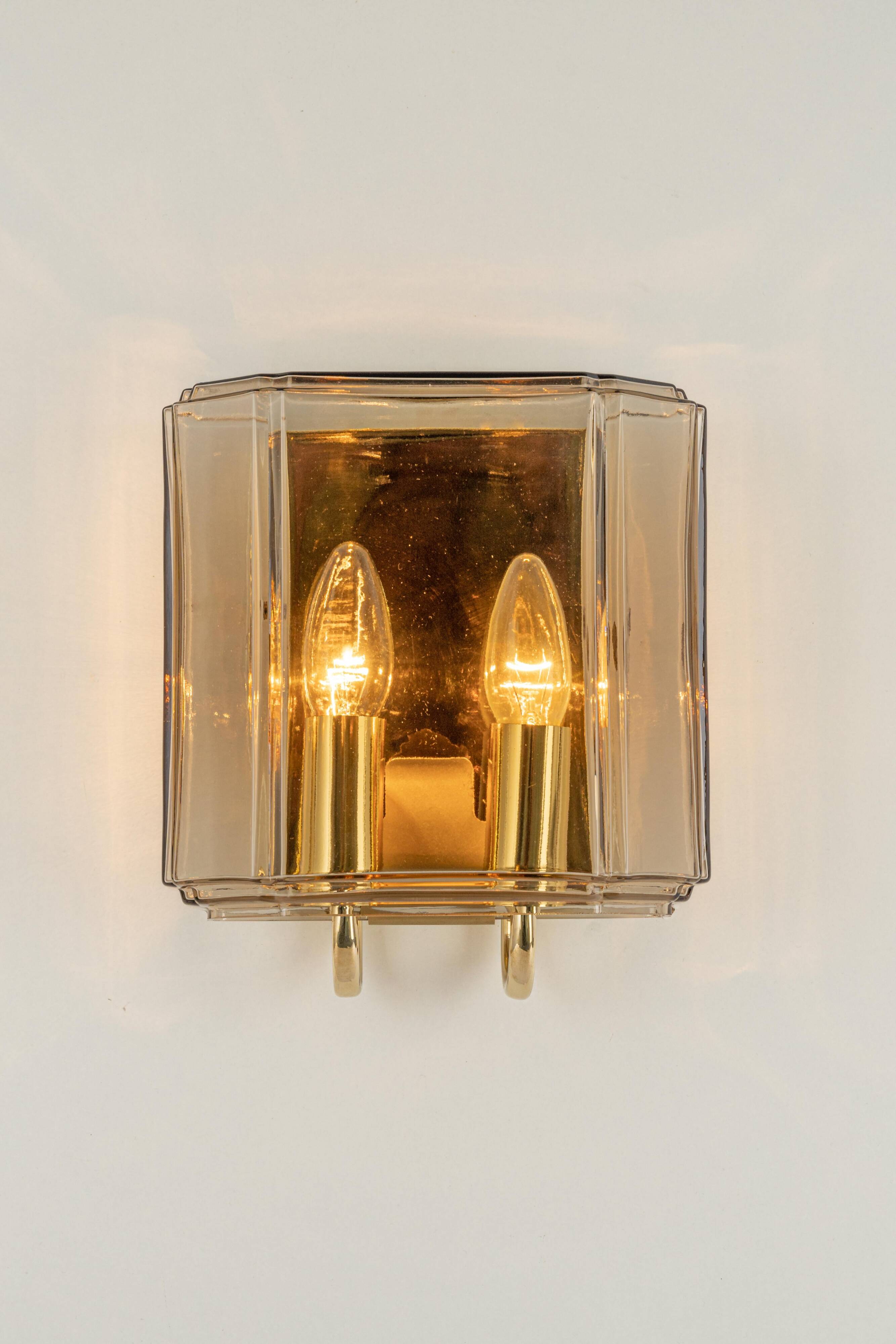Large smoked glass wall sconces by Limburg, Germany.