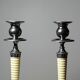 Pair of vintage candlestick holders in silver-plated metal with ivory-style plastic.