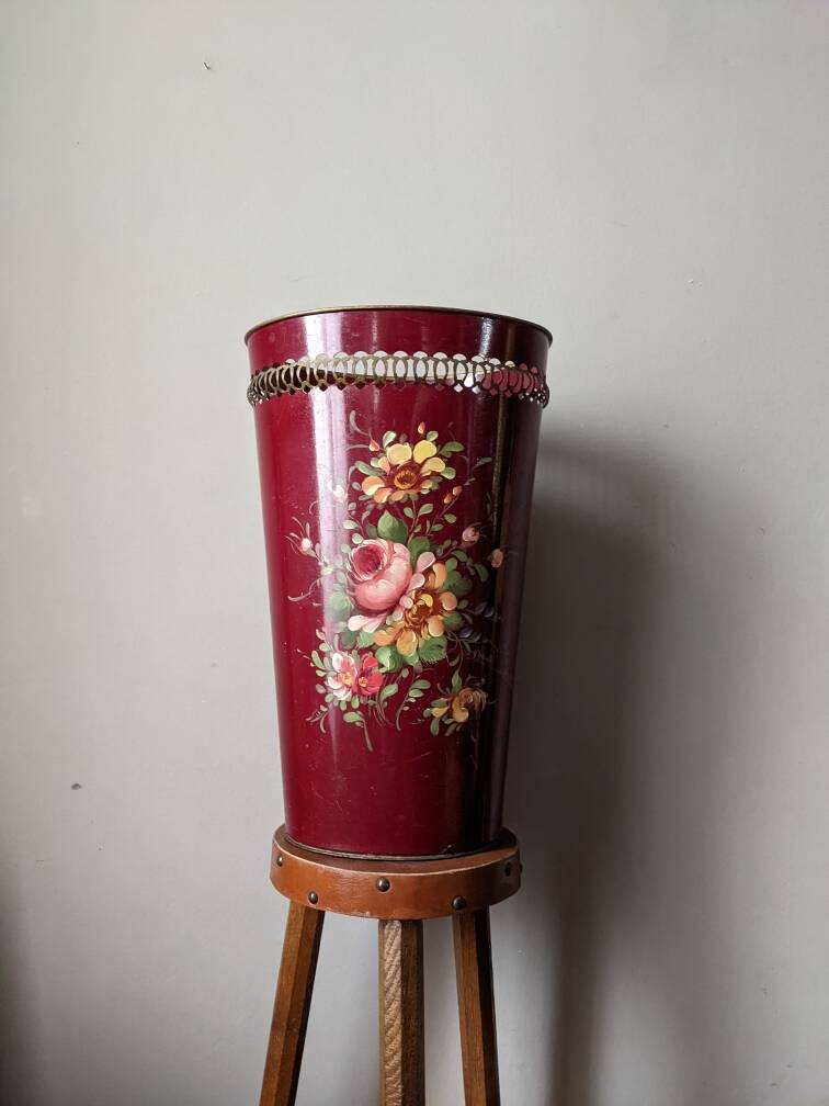 Antique metal umbrella stand with hand-painted floral decor, bohemian countryside