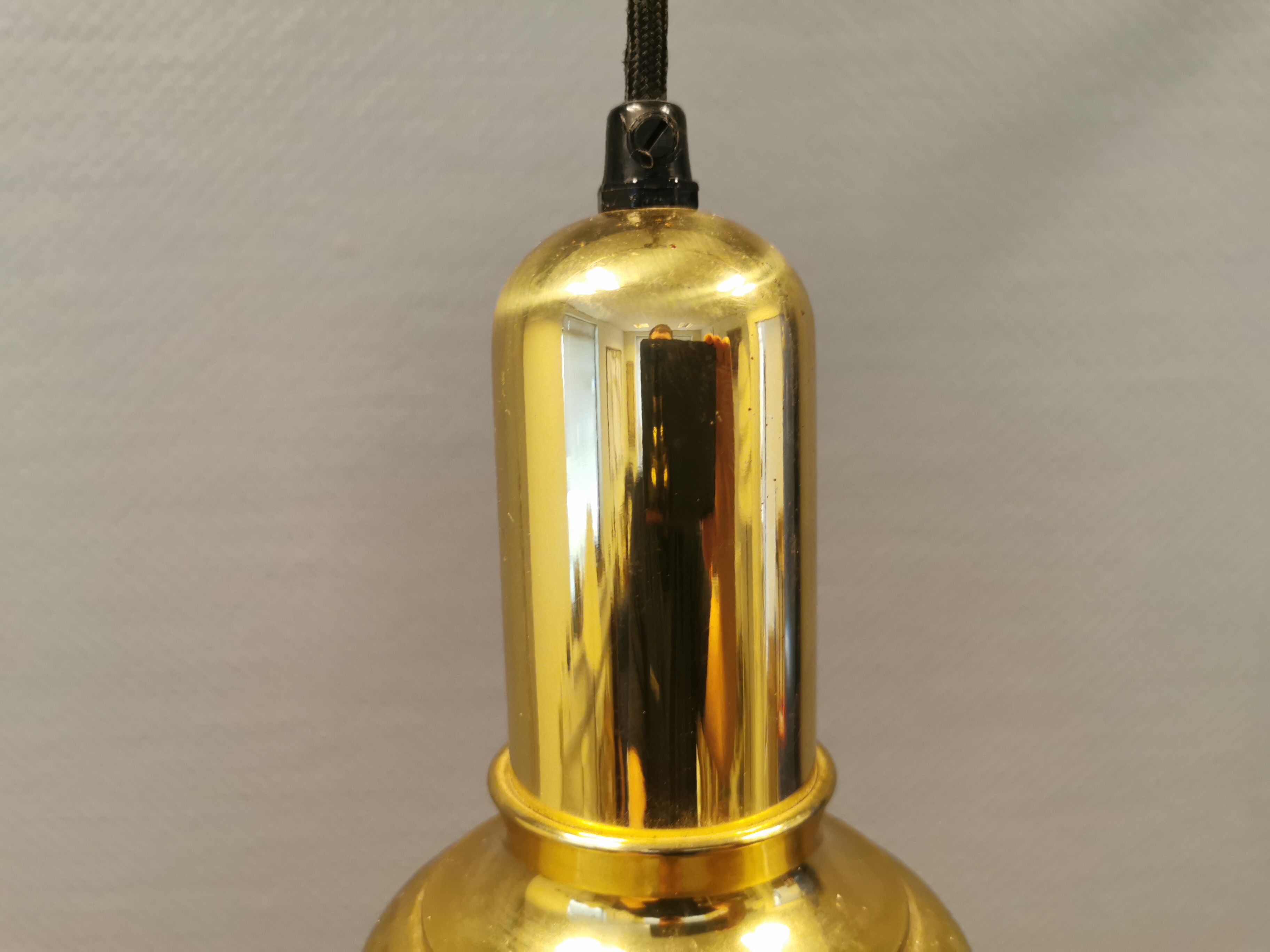 Small golden Danish hanging lamp in metal and brass.