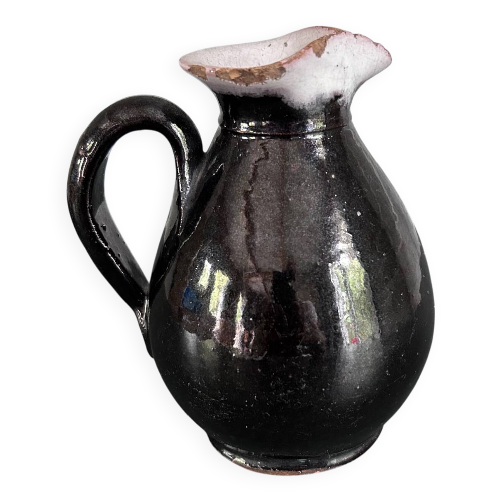 Antique black pitcher with white collar