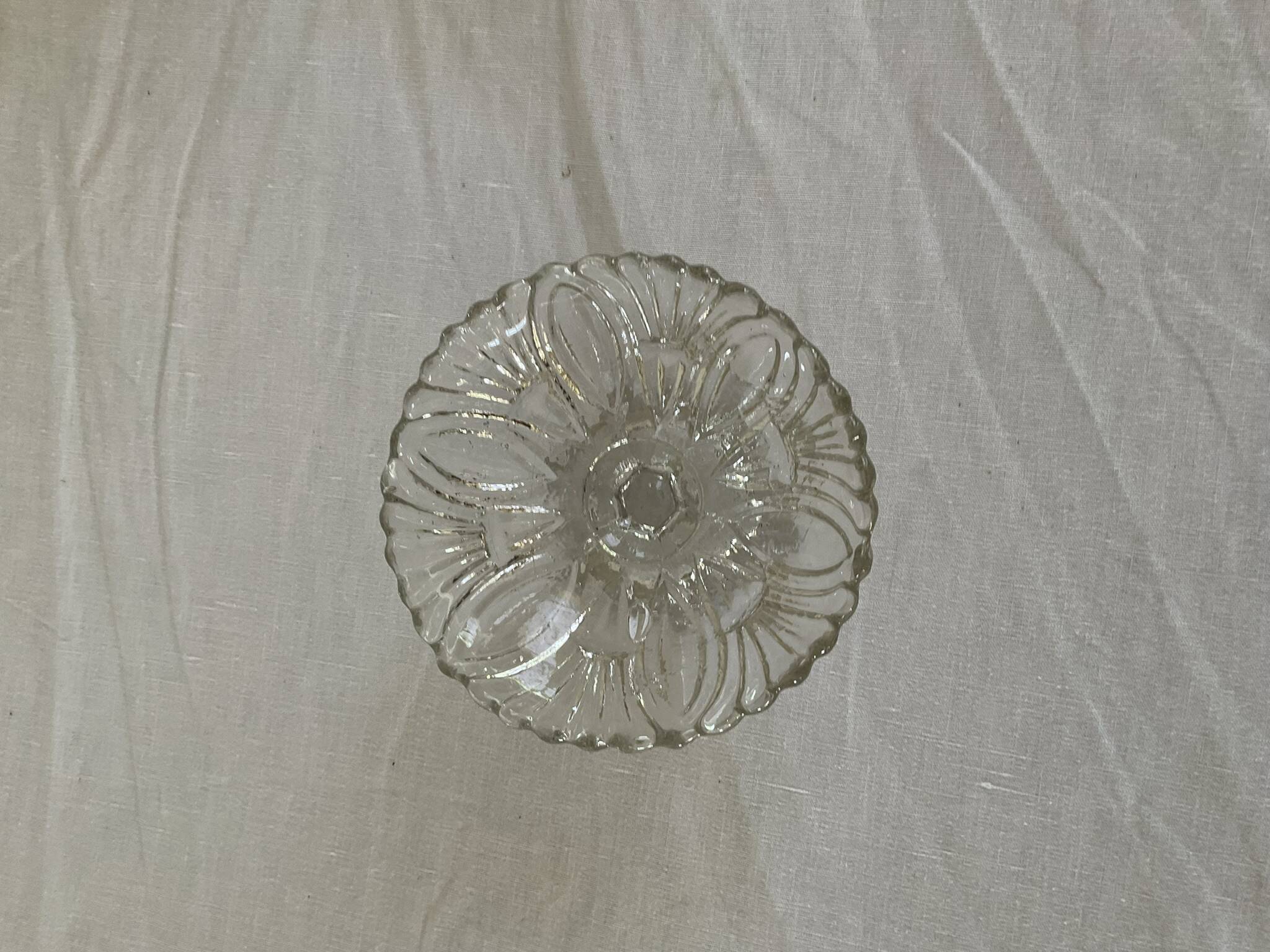Small vintage footed bowl, made of clear moulded glass.