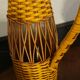 Natural and yellow braided glass and rattan bottle