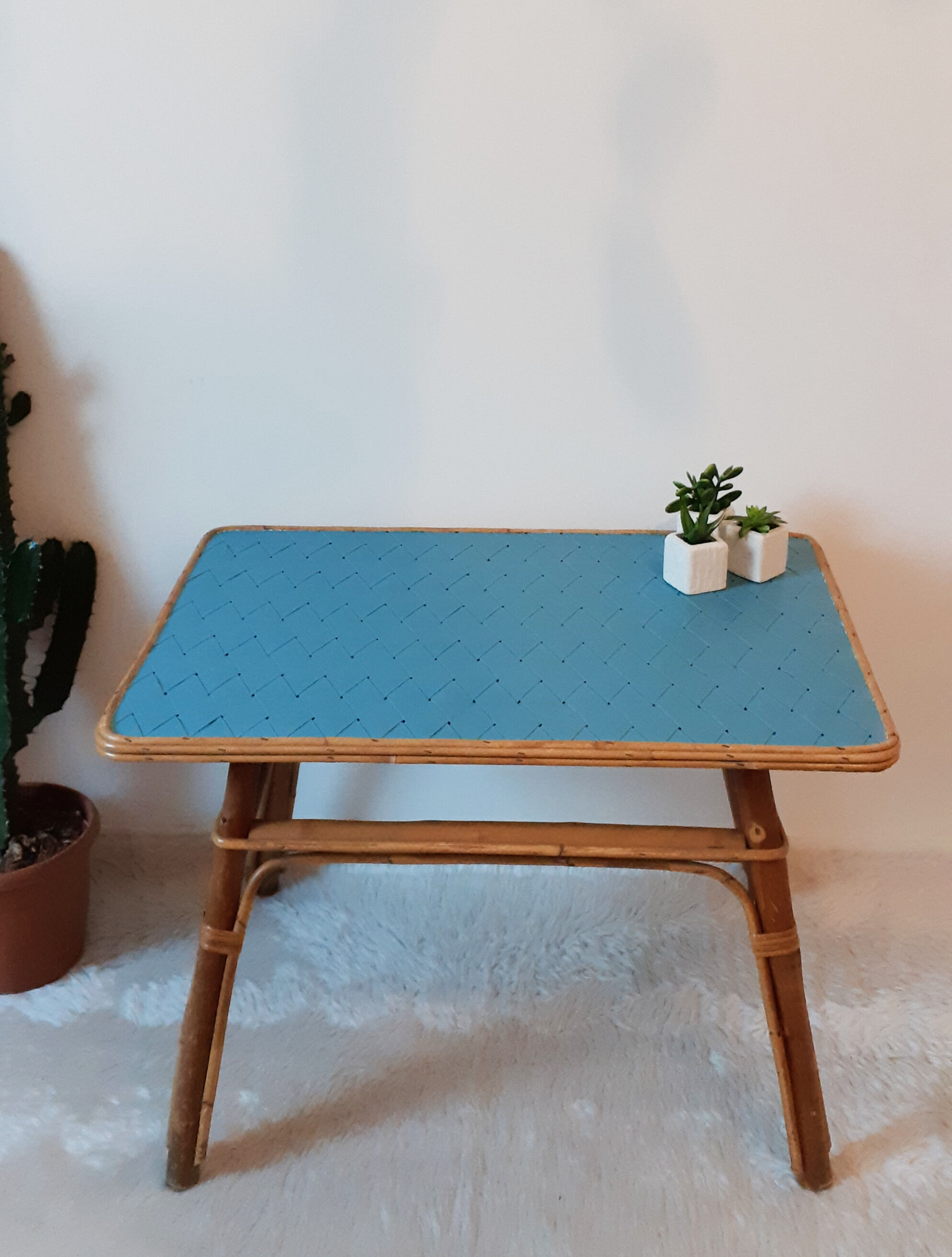 Coffee table in blue rattan
