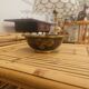 Vintage Asian brass bowl with floral decoration.