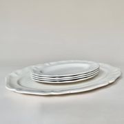 Shaped plates and dishes in Sarreguemines earthenware.