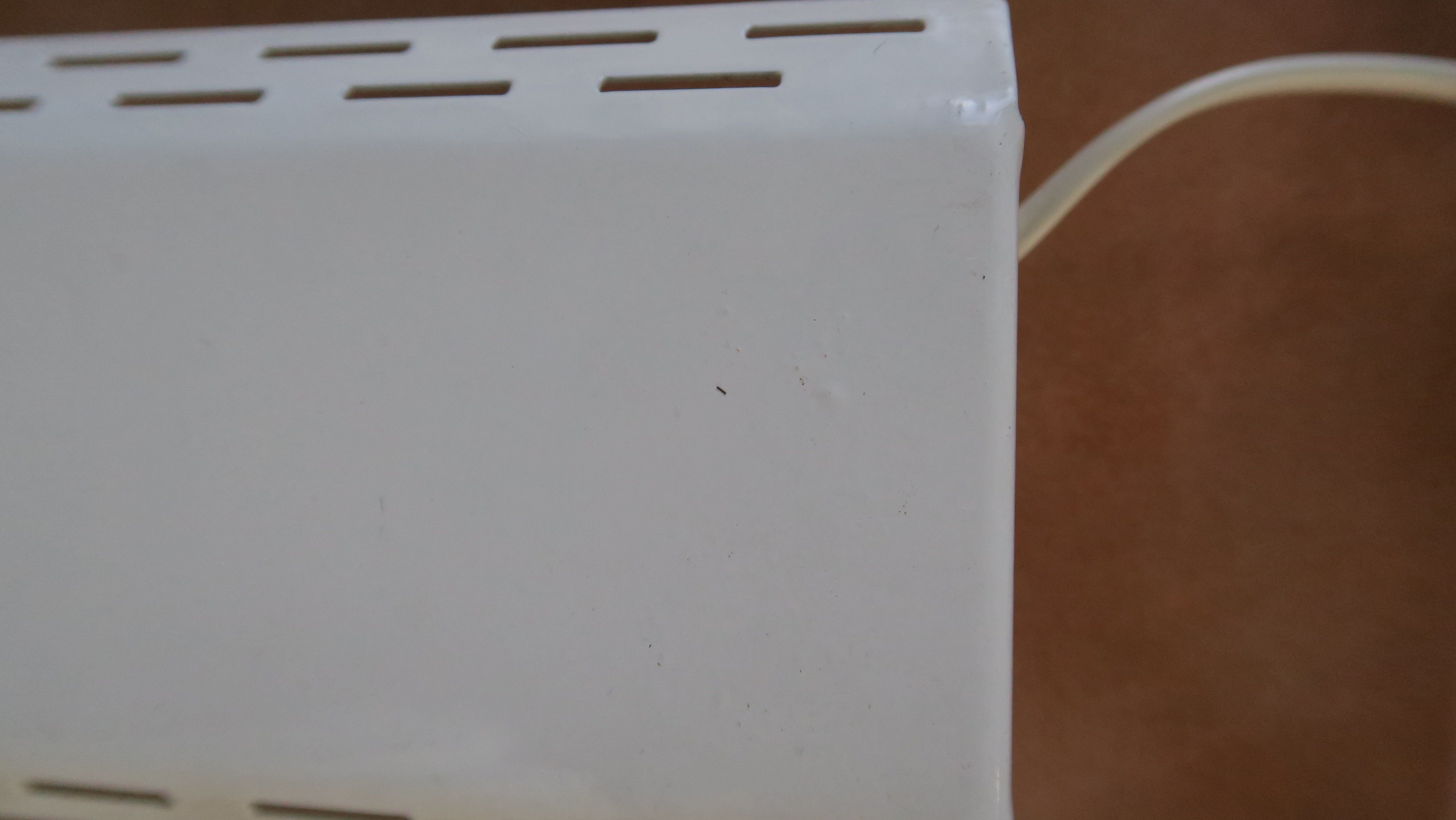 Wall lamp with red swivel shutter