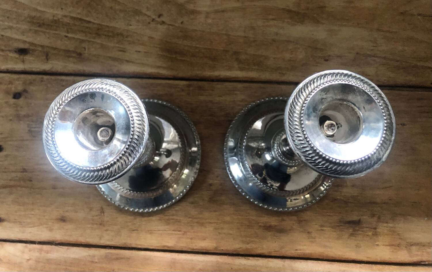Silver metal candle holders that can be paired.