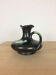 Thulin Belgium pitcher, black ceramic handle