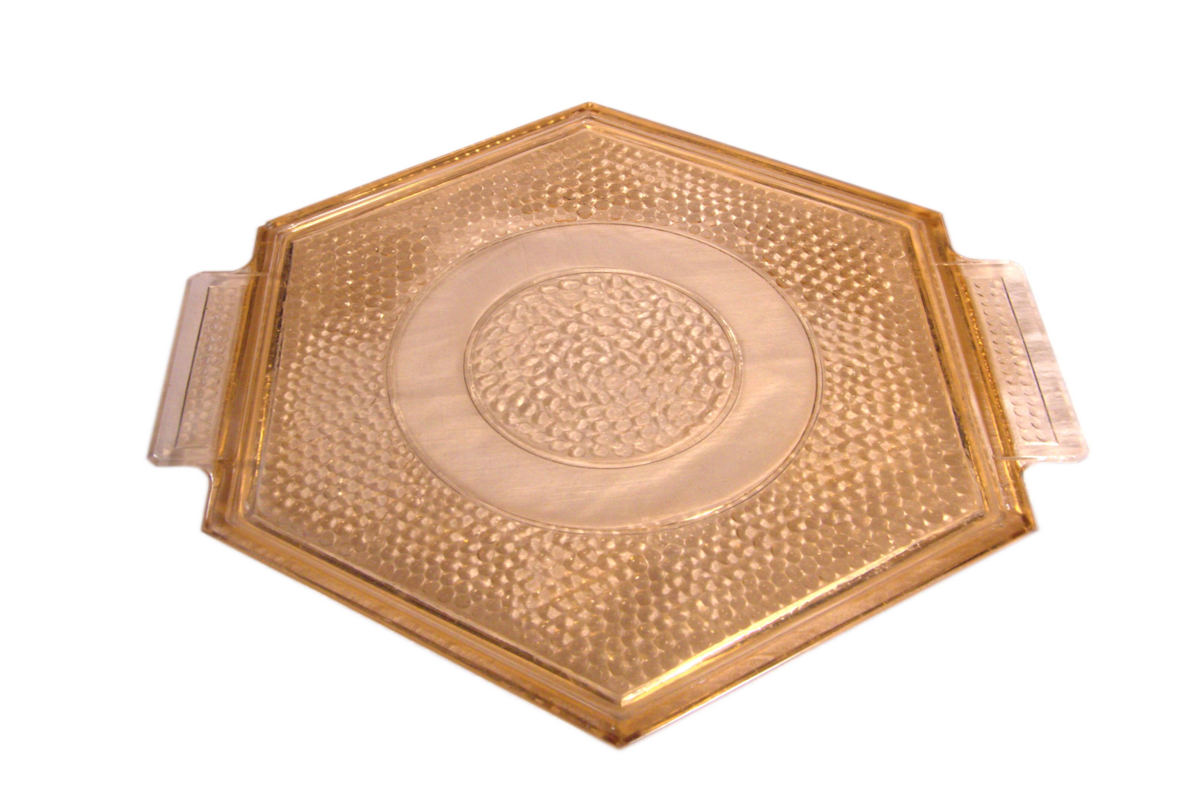 Art Deco hexagonal plate in pressed rose-orange glass, 27cm