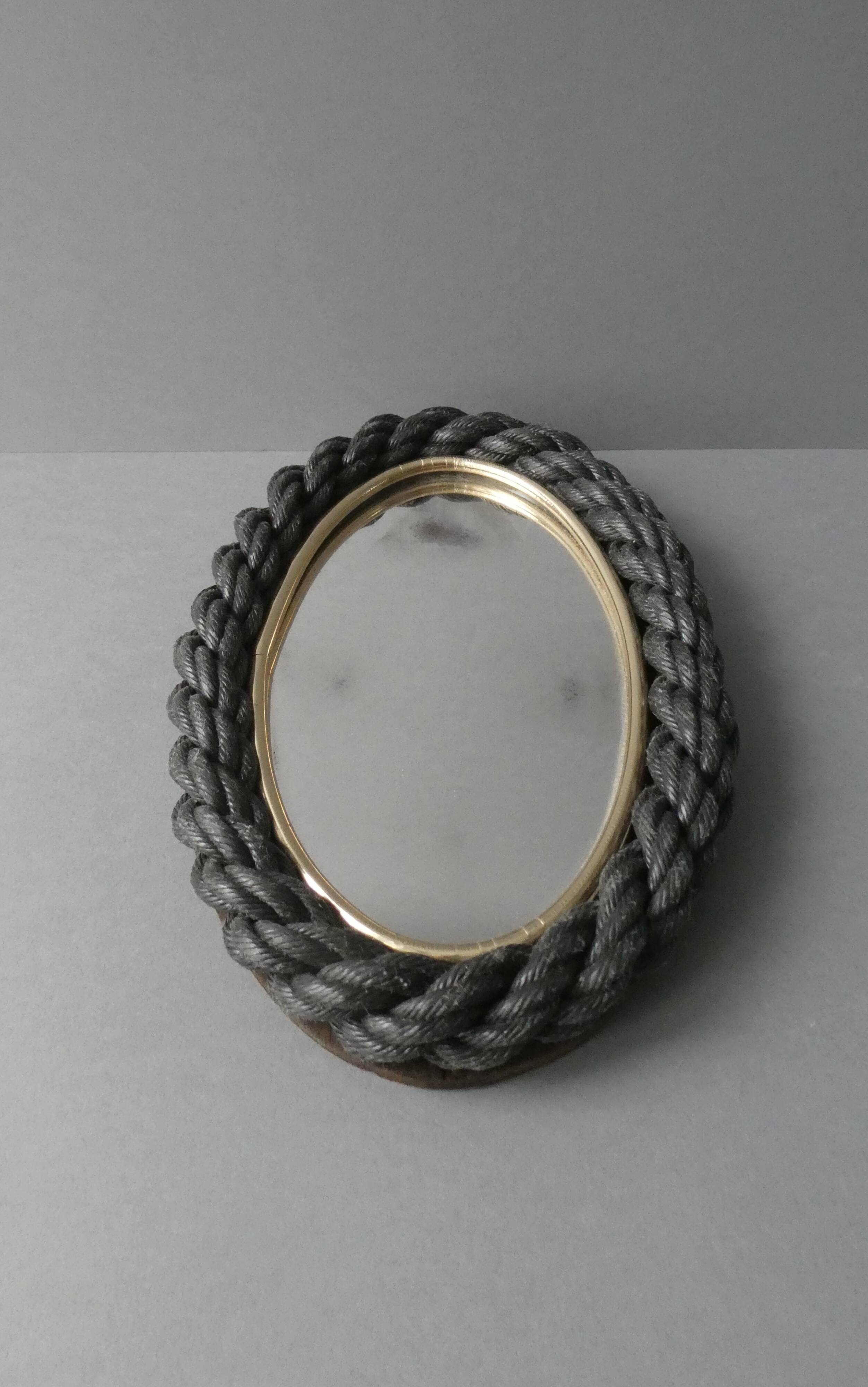 Oval mirror in black rope and gold edging, 1960s