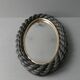Oval mirror in black rope and gold edging, 1960s