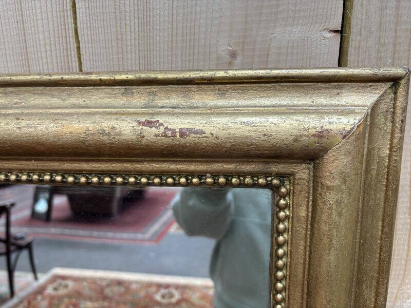 Miroir doré de style Louis XVI