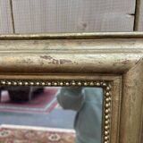 Miroir doré de style Louis XVI