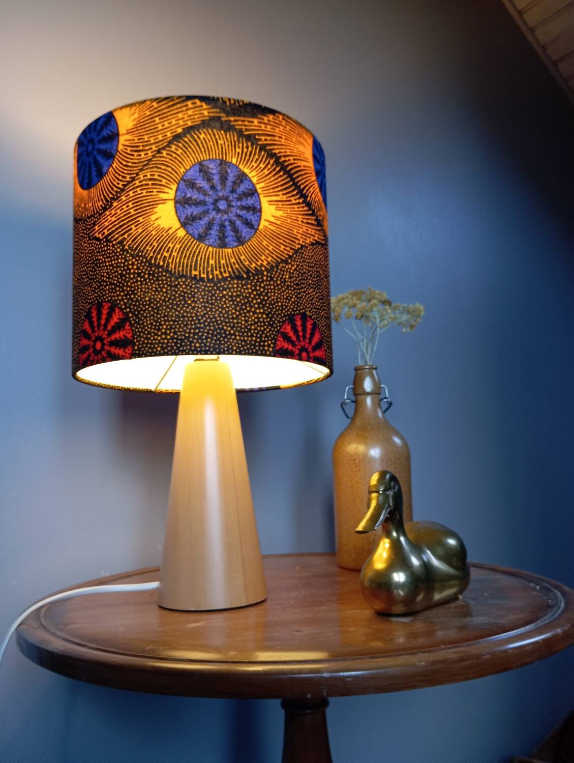 Table lamp in blond wood with handmade wax shade