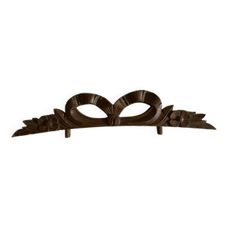 Antique carved wooden ribbon pediment