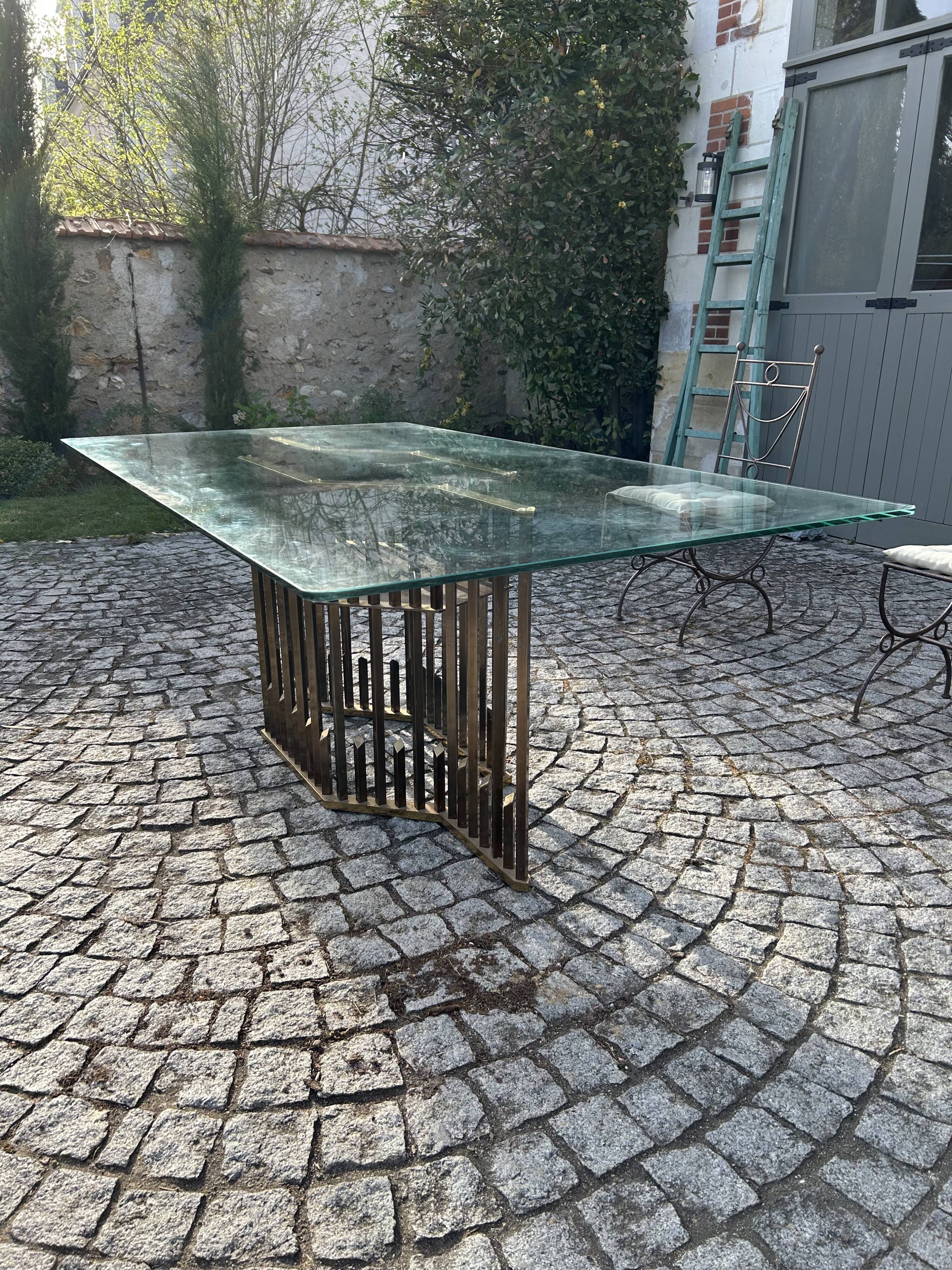 Rectangular glass dining table with brass legs, 1970s.