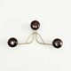 Golden brass coat rack with 3 black vintage hooks from the Mid Century 1950-60.