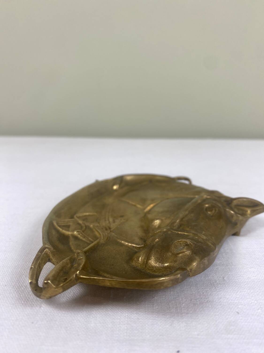 Antique brass pocket emptier