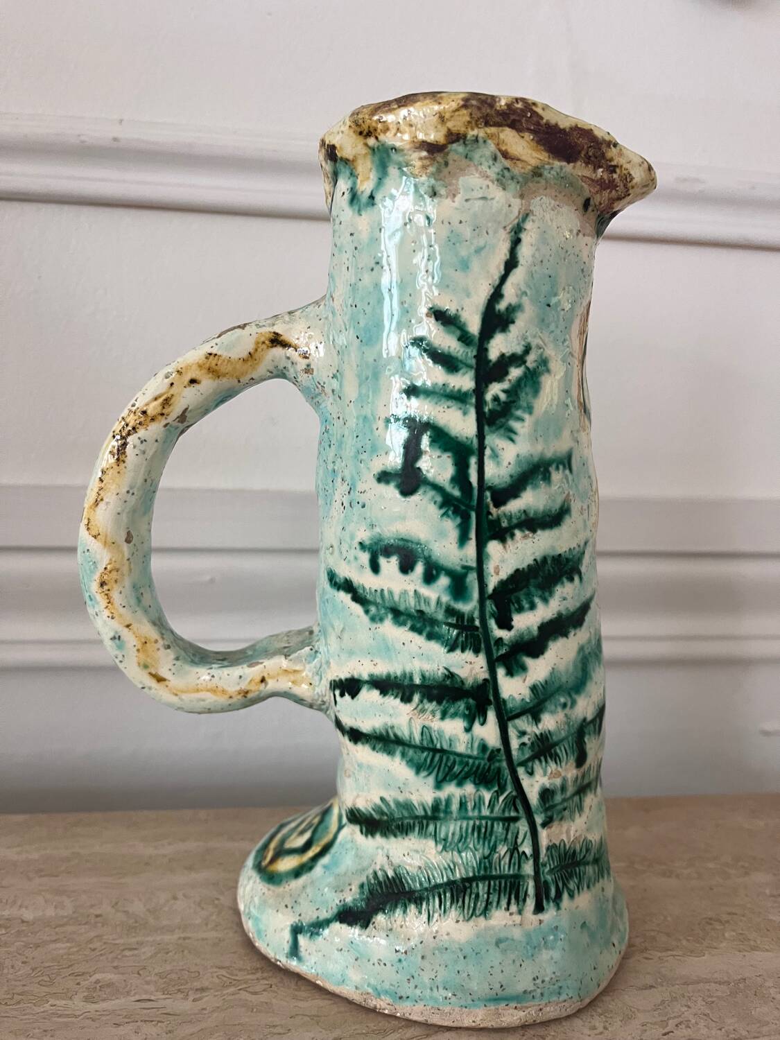 Antique handcrafted ceramic pitcher