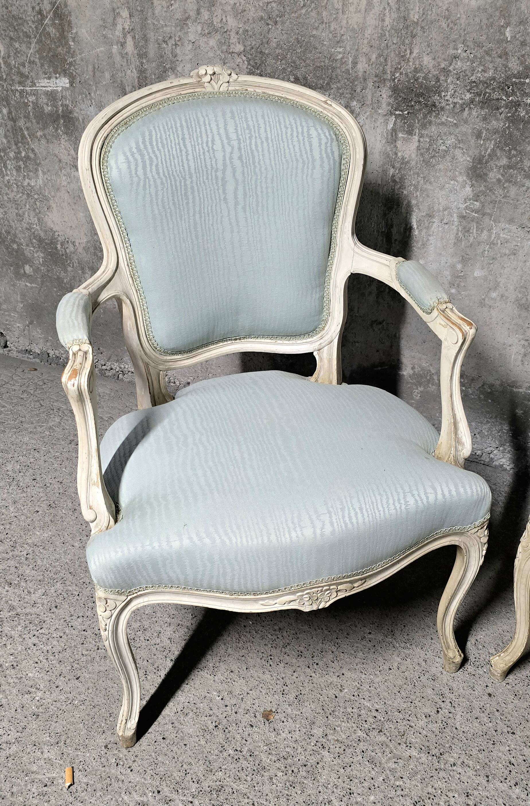 Pair of Louis XV style armchairs in patinated wood, light blue fabric.
