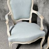 Pair of Louis XV style armchairs in patinated wood, light blue fabric.