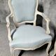 Pair of Louis XV style armchairs in patinated wood, light blue fabric.