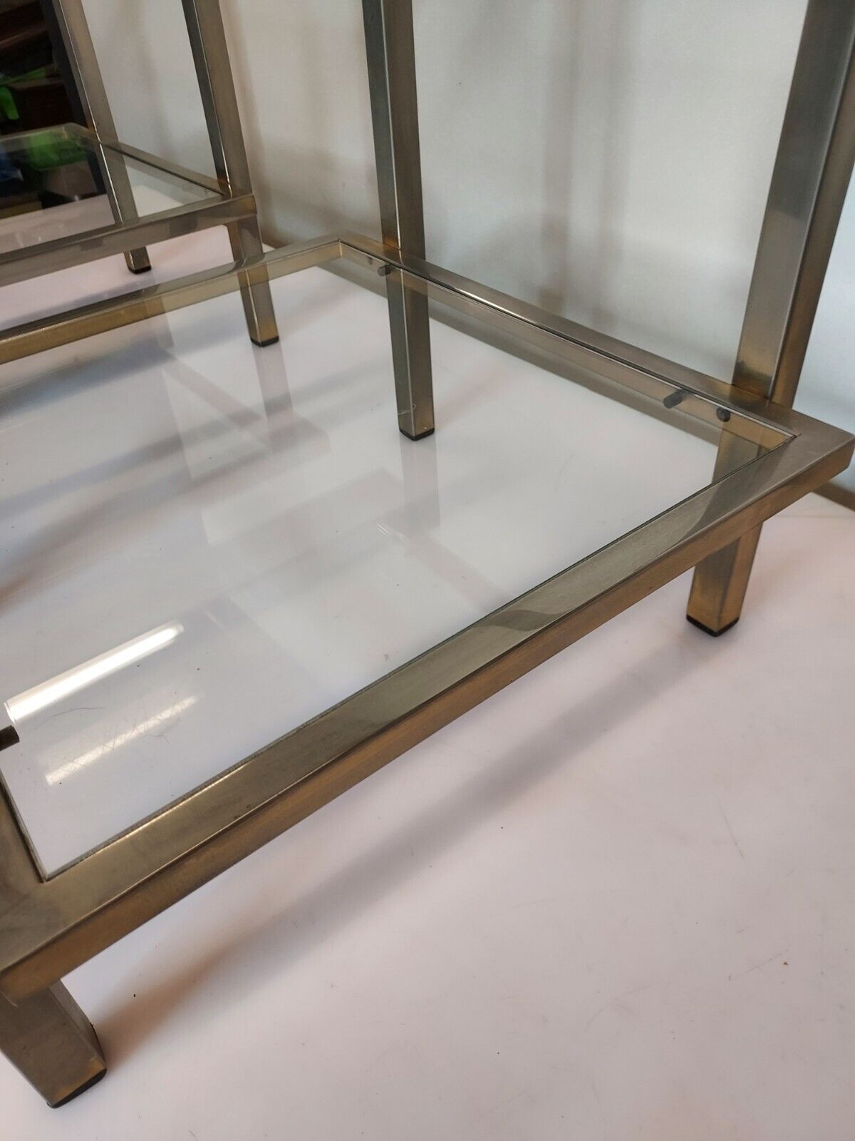 Pair of end of sofas in brushed iron signed Guy Lefevre