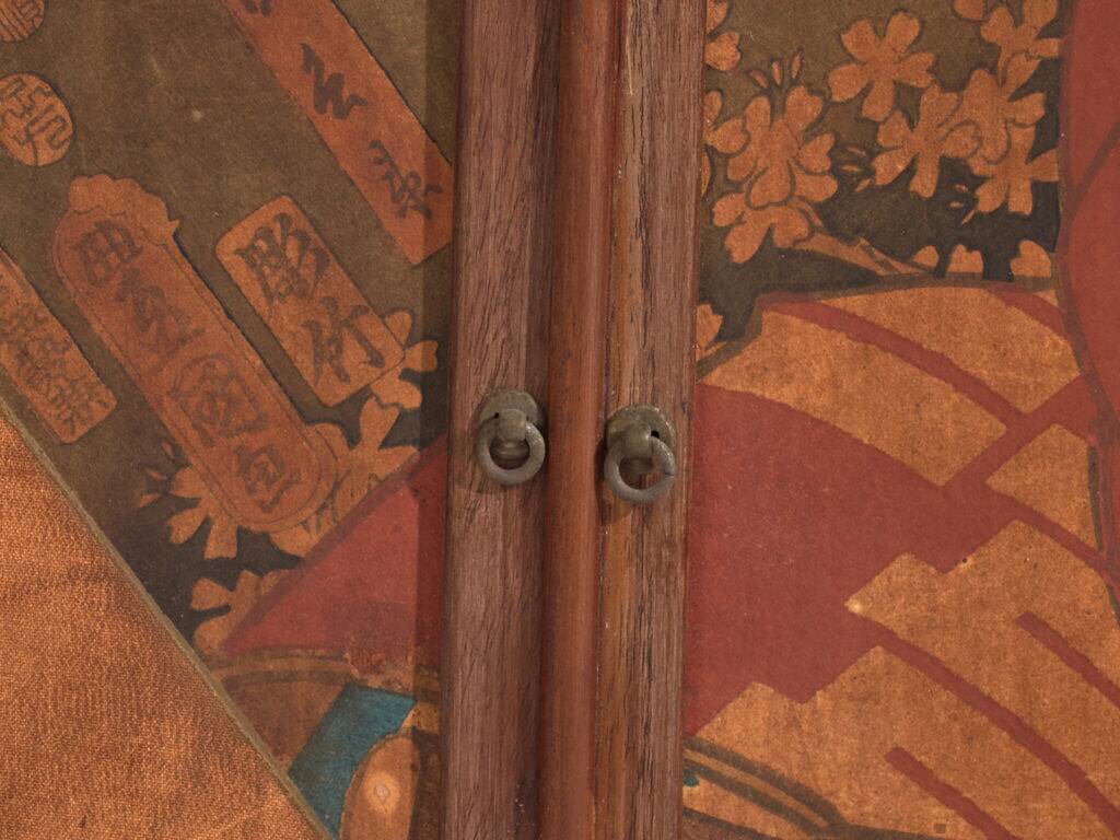 Small Japanese cabinet with sliding doors, Kabuki decoration, made of paulownia wood, early Showa period, circa 1926–1970.