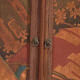 Small Japanese cabinet with sliding doors, Kabuki decoration, made of paulownia wood, early Showa period, circa 1926–1970.