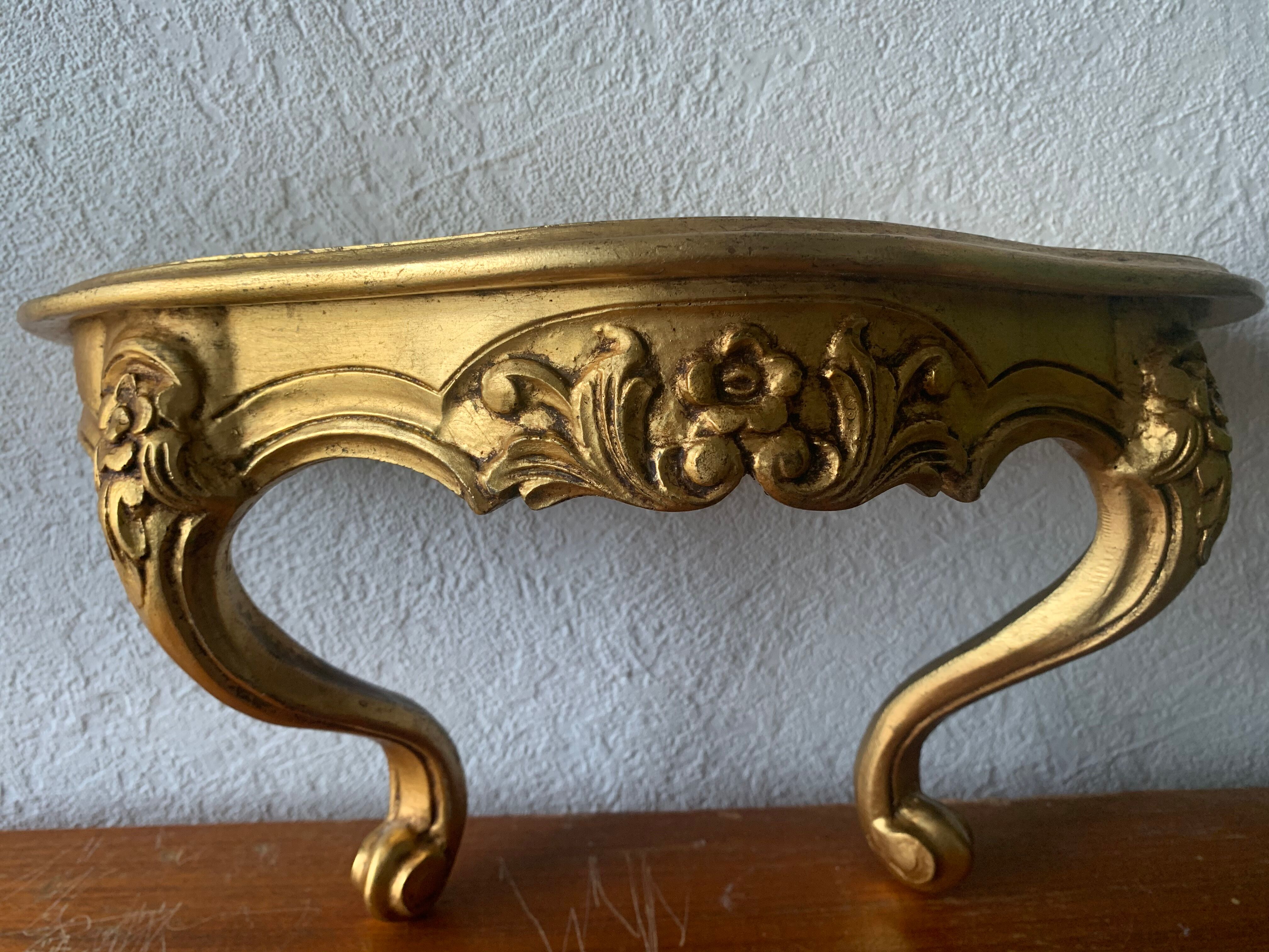 Gold wall shelf sellette