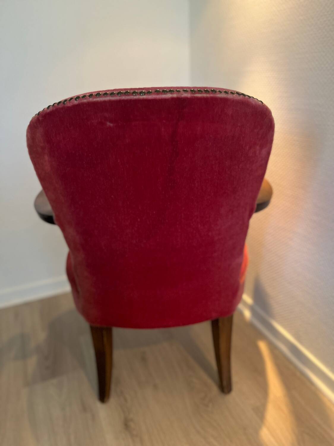 Antique armchair in burgundy velvet