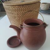 Chinese terracotta teapot with its basket