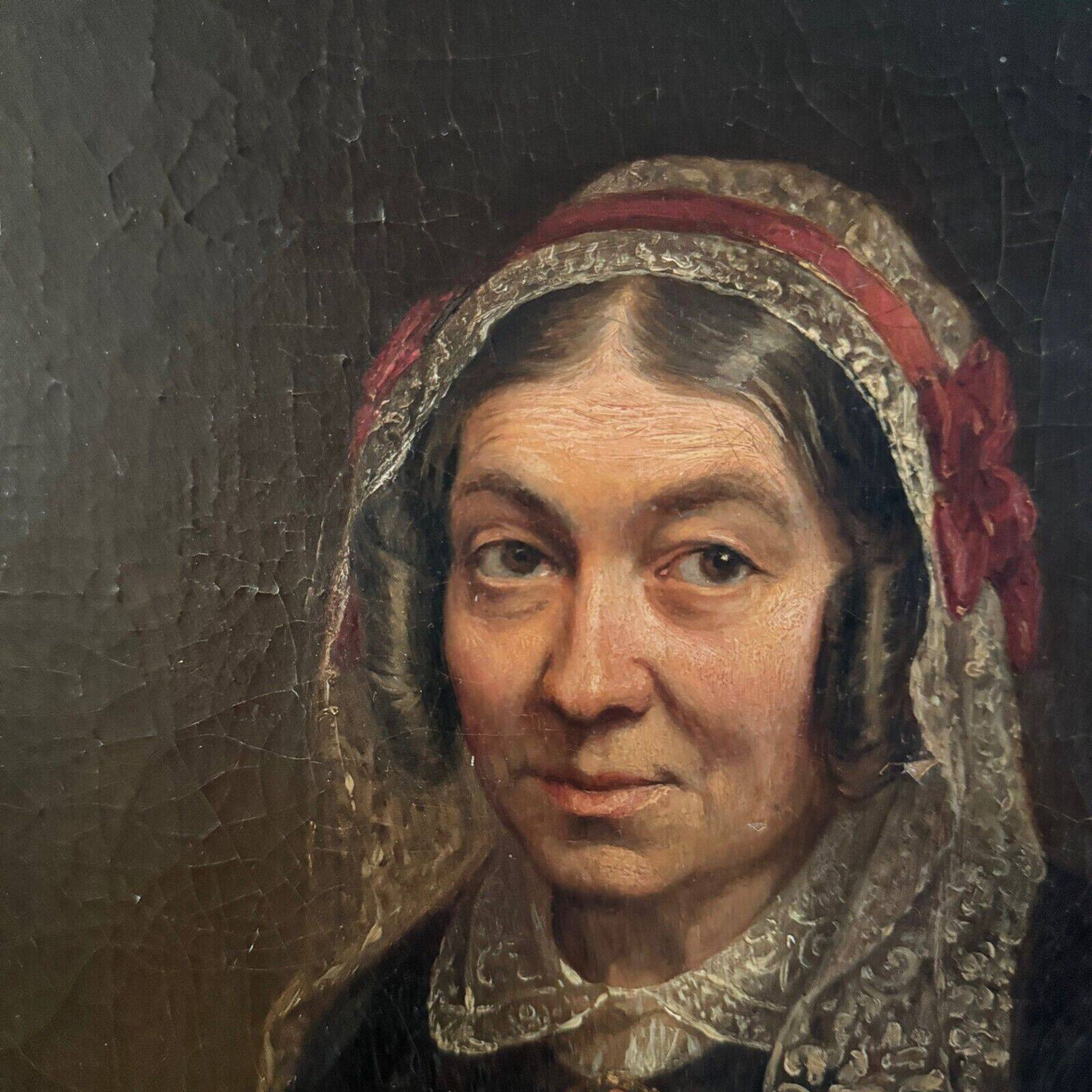 Late 19th century portrait representing a woman with a headdress and lace