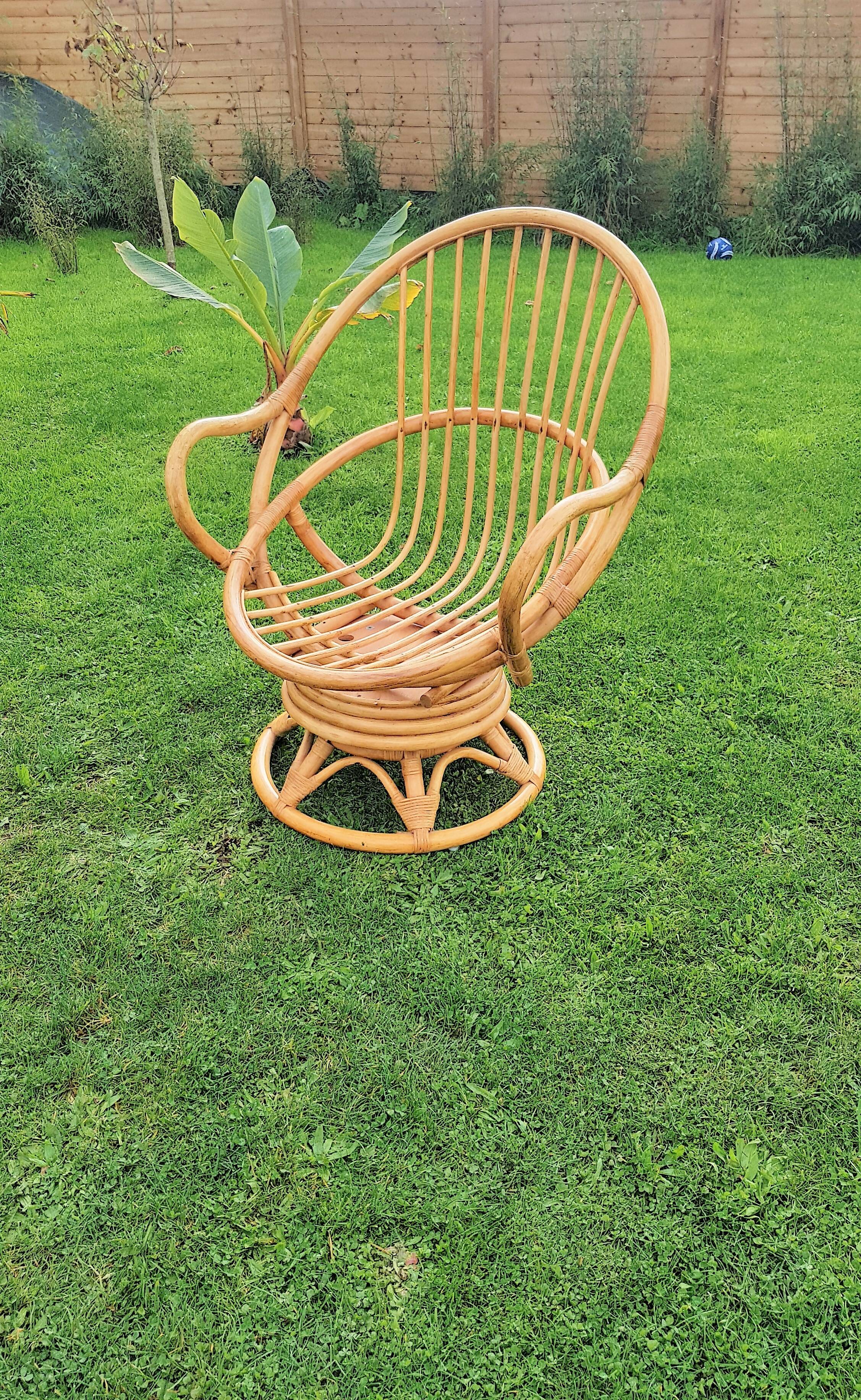 Pair of swivel rattan armchairs