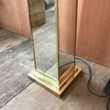 Mirror and gold metal lamppost
