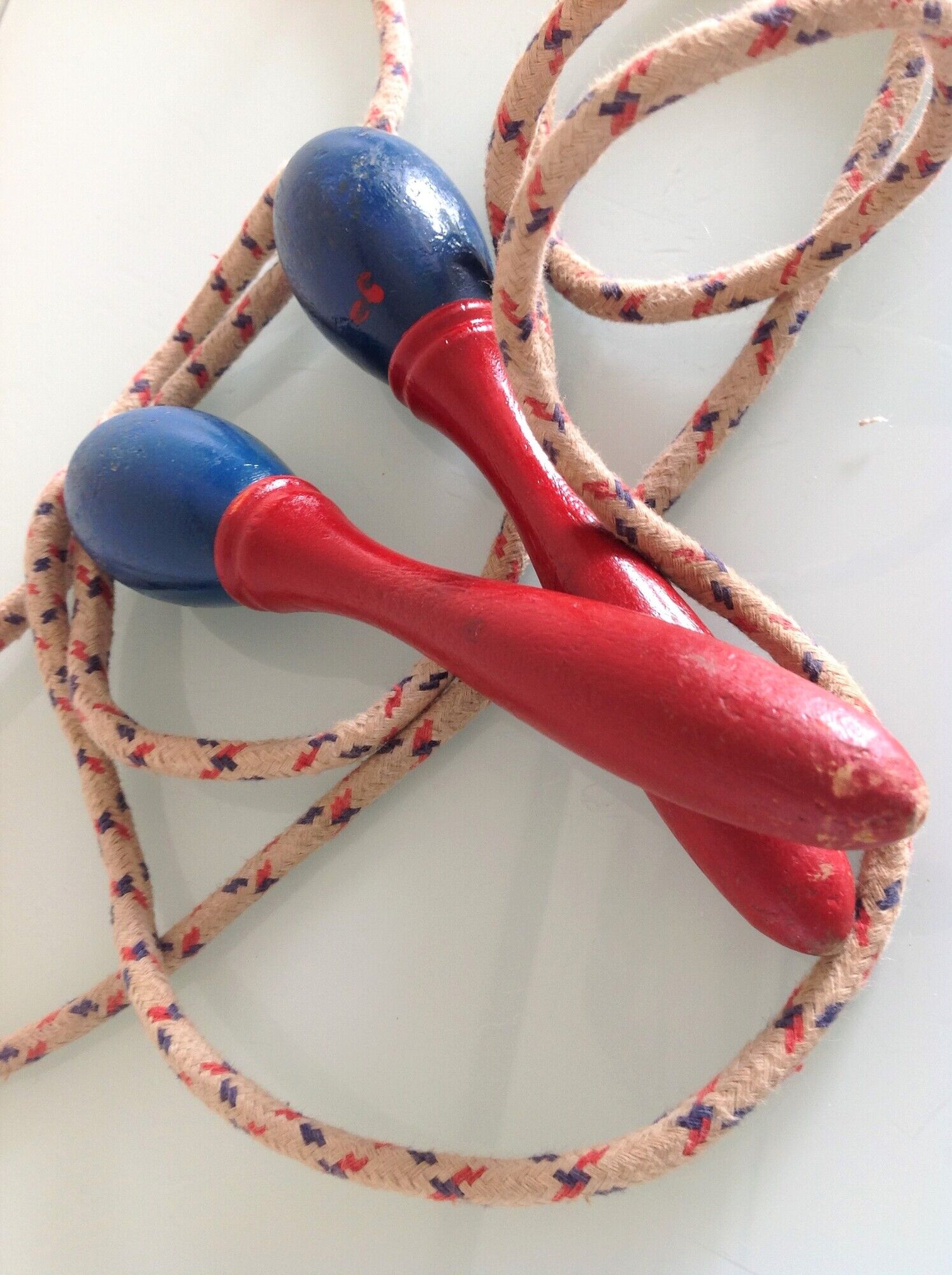 Old wooden jump rope red and blue / vintage