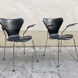 Pair of Arne Jacobsen series 7 chairs in black leather