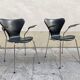 Pair of Arne Jacobsen series 7 chairs in black leather