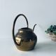 Old brass watering can