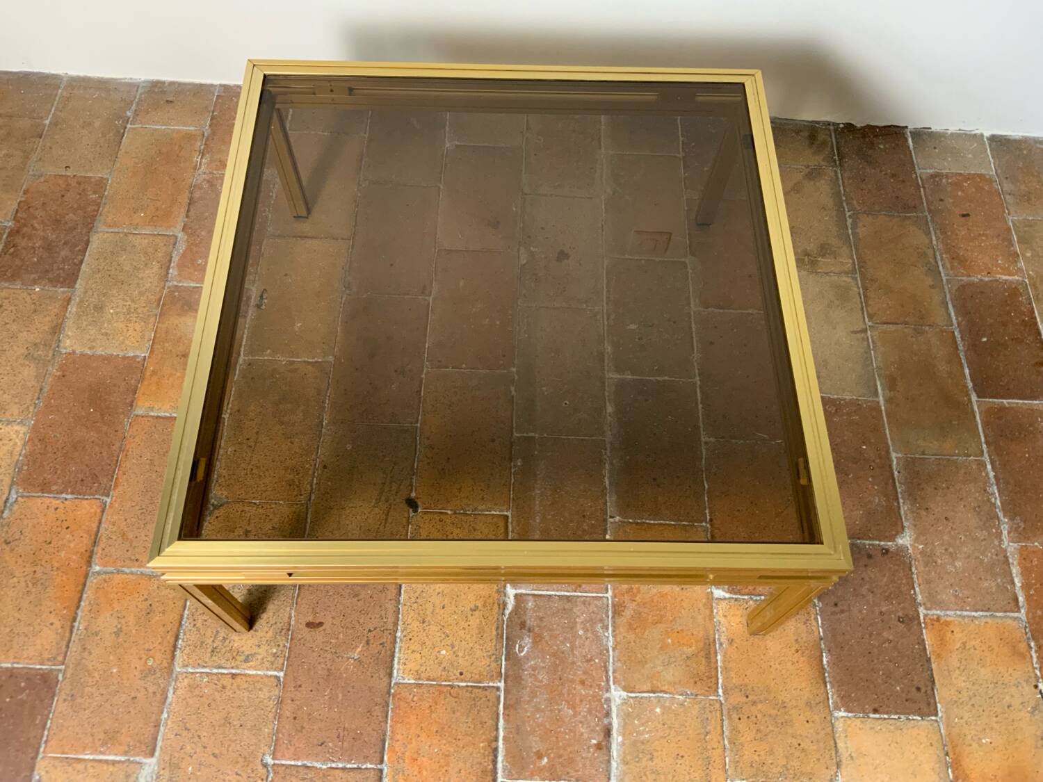 Glass and brass coffee table