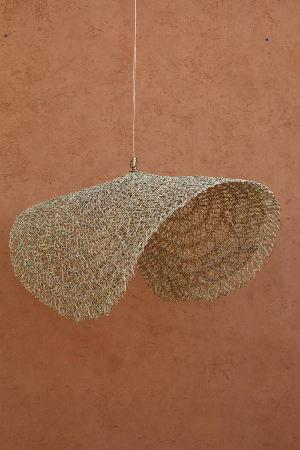 Handmade wicker hanging basket with brass finish