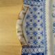 Plate with phosphatic porcelain decoration