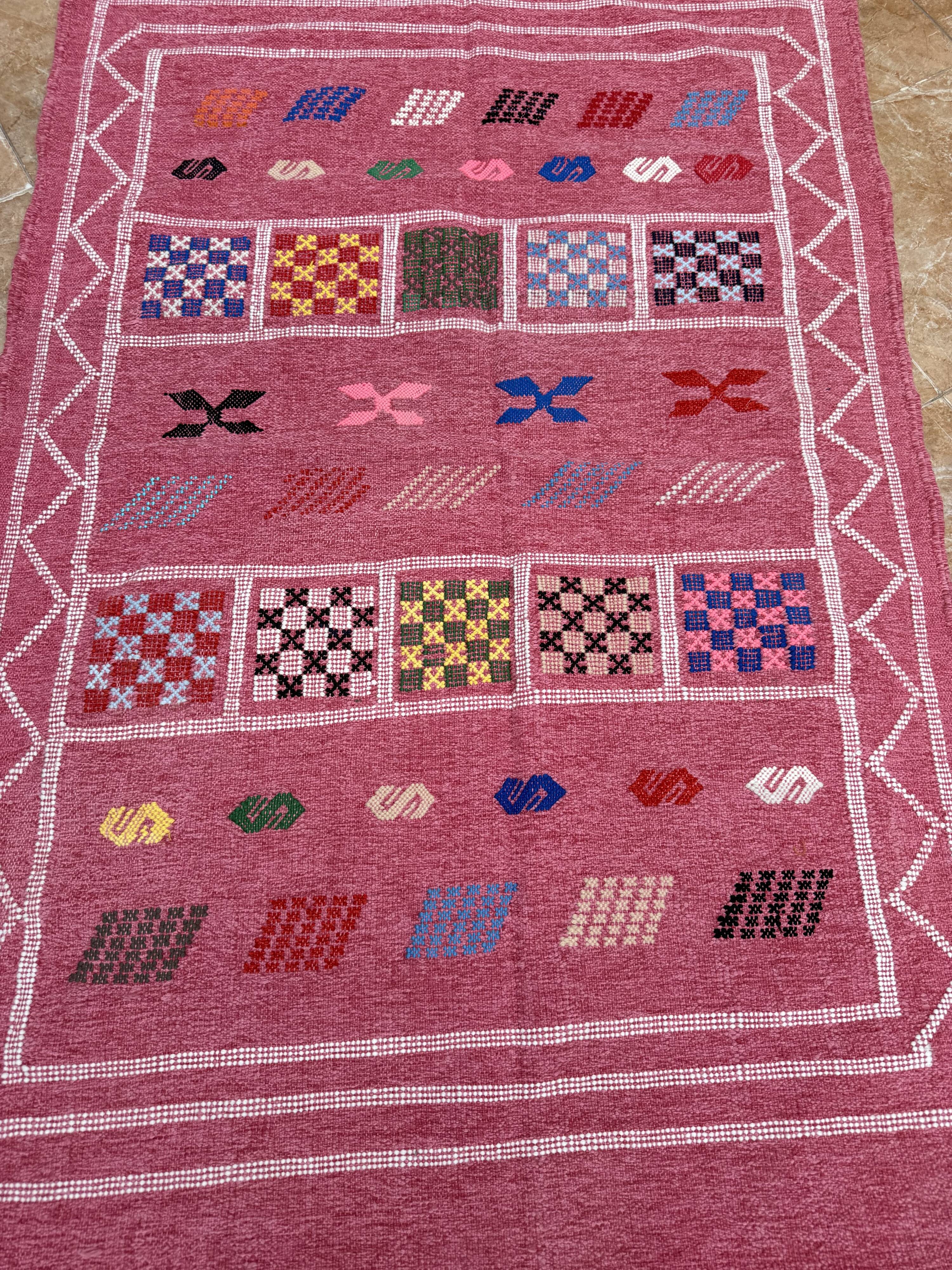 Handmade Moroccan wool rug: Berber Azilal style, geometric pattern.
