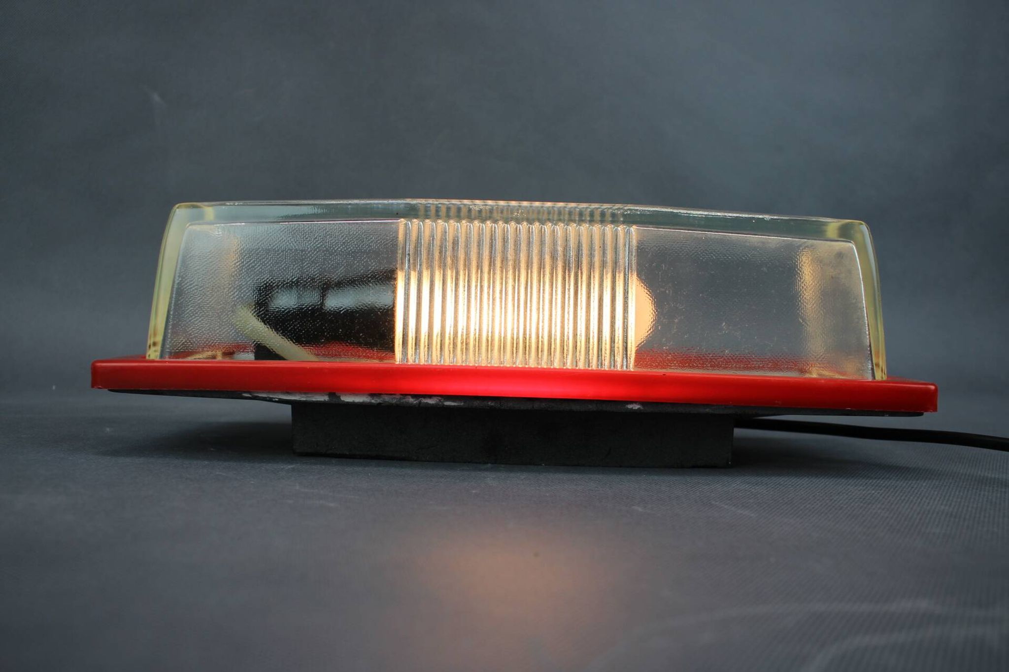 1970s Czech space age wall light with red plastic and glass.