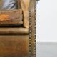 Green antique English cowhide leather armchair on wheels