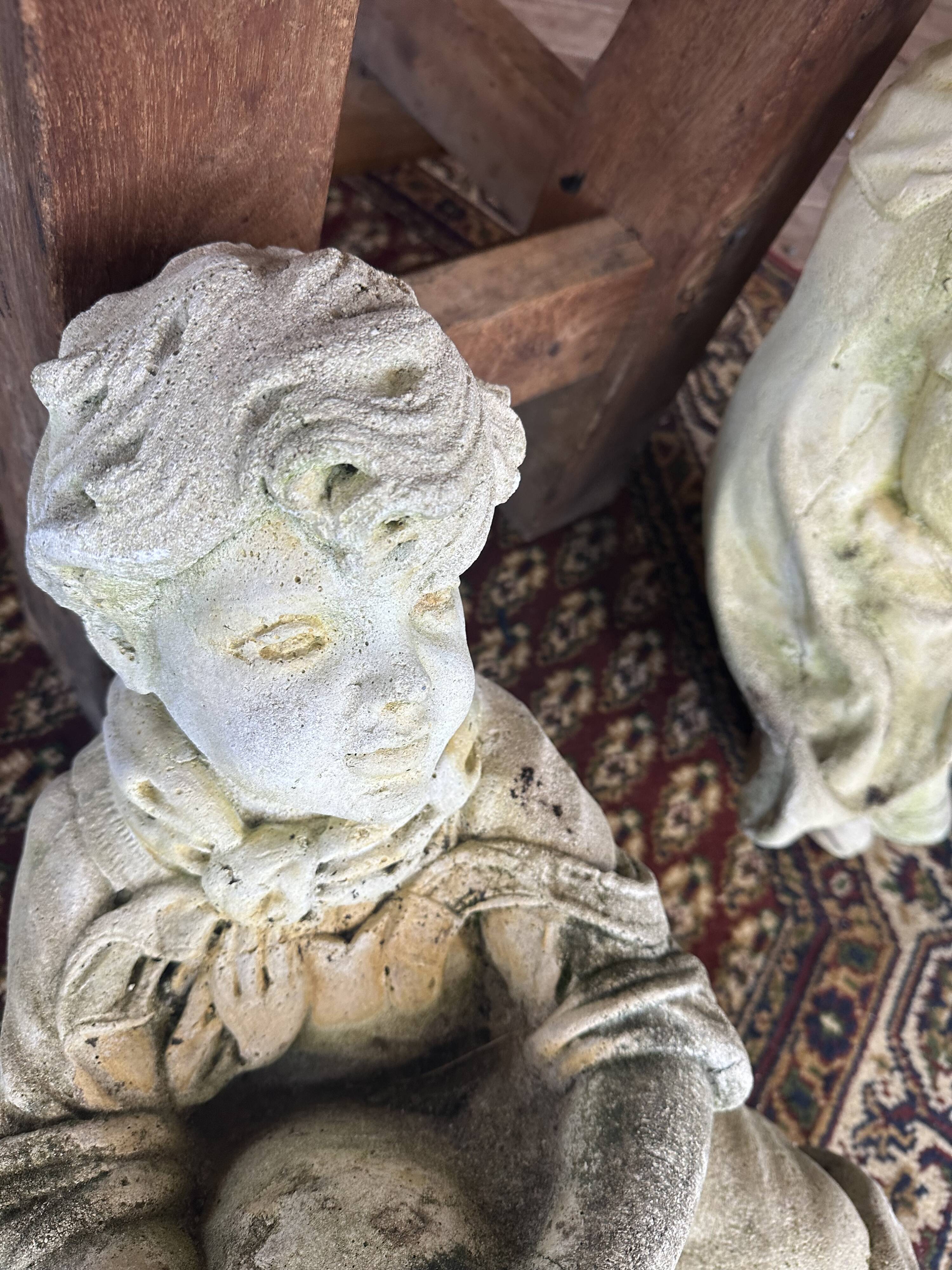 Stone child garden statue