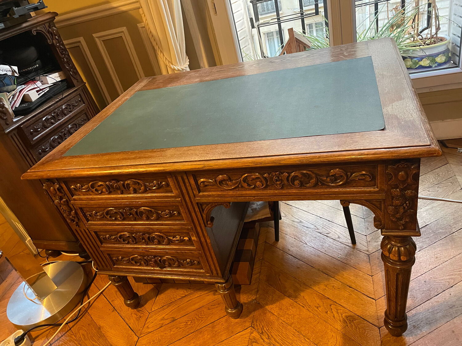 Solid wood desk and green leather writing pad