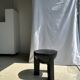 Black mango wood tripod side table with a semi-spherical top, height: 45 cm, diameter: 44 cm.